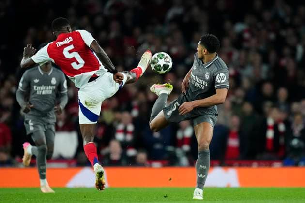 Arsenal FC v Real Madrid C.F. - UEFA Champions League 2024 25 Quarter Final First Leg Thomas Partey defensive midfield of Arsenal and Ghana and Jude Bellingham central midfield of Real Madrid and England compete for the ball during the UEFA Champions League 2024 25 Quarter Final First Leg match between Arsenal FC and Real Madrid C.F. at Arsenal Stadium on April 8, 2025 in London, England. London England United Kingdom  Copyright: xJosexBretonx originalFilename:bretonhernandez-arsenalf250408_nptke.jpg