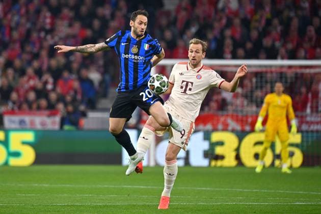 Hakan CALHANOGLU Milan , action,duel against Harry KANE Bayern Muenchen football Champions League quarter-final FC Bayern Muenchen Inter Milan 1 2 on 08 04 2025 , A L L I A N Z A R E N A