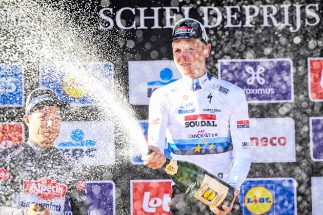 Belgian Tim Merlier of Soudal Quick-Step celebrates on the podium after winning the men s race of the 113th edition of the Scheldeprijs one day cycling event, 202,8 km from Terneuzen, the Netherlands to Schoten, Belgium on Wednesday 09 April 2025. TOM GOYVAERTS TomxGoyvaerts  x120395932x