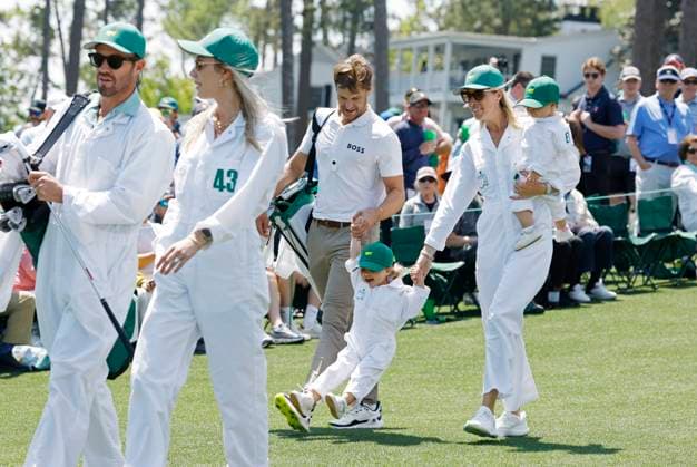 Thomas Detry of Belgium and his wife Sarah play with one of their children as they take part in the 2025 Masters Par 3 Contest at Augusta National Golf Club in Augusta, Georgia, on Wednesday, April 9, 2025. The 2025 Masters Golf tournament begins on Thursday, April 10.  AUG20250409846 JOHNxANGELILLO