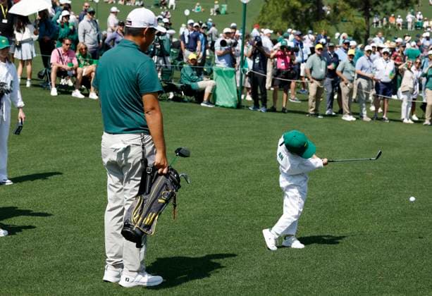 Byeong-hun An and his wife Jamie Heejae An watch as one of their children tees off during the 2025 Masters Par 3 Contest at Augusta National Golf Club in Augusta, Georgia, on Wednesday, April 9, 2025. The 2025 Masters Golf tournament begins on Thursday, April 10.  AUG20250409853 JOHNxANGELILLO