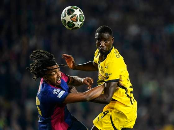 ESP: FC Barcelona, Barca v Borussia Dortmund. UEFA Champions League match. Quarter-Finals, firs leg Jules Kounde of FC Barcelona and Serhou Guirassy of Borussia Dortmund during the UEFA Champions League match, Quarter-Finals, firs leg, between FC Barcelona and Borussia Dortmund played at Lluis Companys Stadium on April 9 2025 in Barcelona Spain. kpng Copyright: xSergioxRuizx xImagox PS_250409_BAR_DOR_018