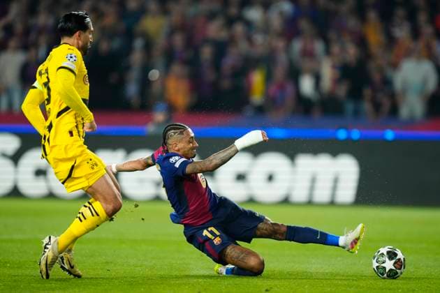 FC Barcelona, Barca v Borussia Dortmund - UEFA Champions League 2024 25 Quarter Final First Leg Raphinha right winger of Barcelona and Brazil shooting to goal front Emre Can defensive midfield of Borussia Dortmund and Germany during the UEFA Champions League 2024 25 Quarter Final First Leg match between FC Barcelona and Borussia Dortmund at Estadi Olimpic Lluis Companys on April 9, 2025 in Barcelona, Spain. Barcelona Spain  Copyright: xJosexBretonx originalFilename:bretonhernandez-fcbarcel250409_npFUJ.jpg