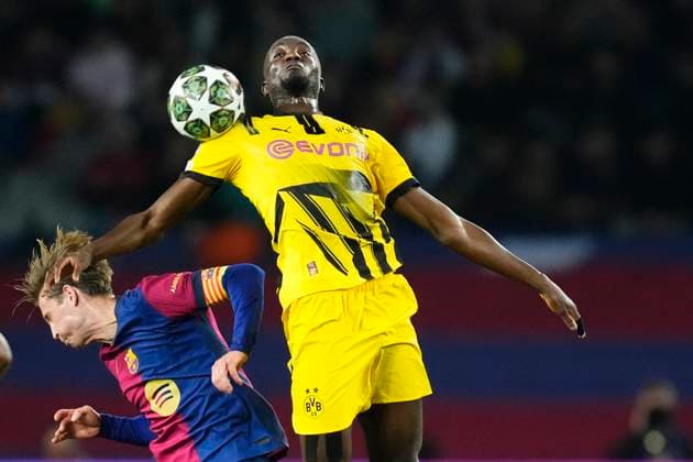 FC Barcelona, Barca v Borussia Dortmund - UEFA Champions League 2024 25 Quarter Final First Leg Serhou Guirassy centre-forward of Borussia Dortmund and Guinea and Frenkie de Jong central midfield of Barcelona and Netherlands compete for the ball during the UEFA Champions League 2024 25 Quarter Final First Leg match between FC Barcelona and Borussia Dortmund at Estadi Olimpic Lluis Companys on April 9, 2025 in Barcelona, Spain. Barcelona Spain  Copyright: xJosexBretonx originalFilename:bretonhernandez-fcbarcel250409_npc1t.jpg