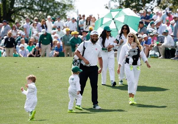 Jon Rahm of Spain walks with his wife Kelley Cahill and their children Kepa, Eneko and Alaia during the 2025 Masters Par 3 Contest at Augusta National Golf Club in Augusta, Georgia, on Wednesday, April 9, 2025. The 2025 Masters Golf tournament begins on Thursday, April 10.  AUG20250409871 JOHNxANGELILLO