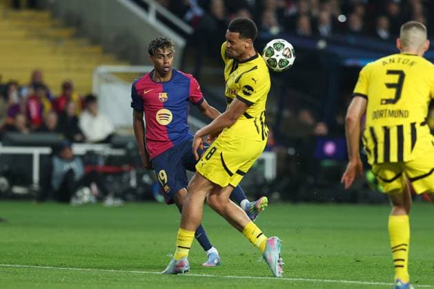 April 9, 2025, Barcelona, Barcelona, SPAIN: Lamine Yamal of FC Barcelona, Barca and Felix Nmecha of Borussia Dortmund in action during the UEFA Champions League 2024 25 quarter-final first leg, match between FC Barcelona and Borussia Dortmund at Estadi Olimpic Lluis Companys on April 09, 2025 in Barcelona, Spain. Barcelona SPAIN - ZUMAa181 20250409_zaa_a181_048 Copyright: xIrinaxR.xHipolitox