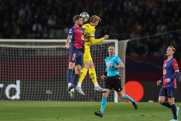 April 9, 2025, Barcelona, Barcelona, SPAIN: Inigo Martinez of FC Barcelona, Barca and Julian Brandt of Borussia Dortmund compete for the ball during the UEFA Champions League 2024 25 quarter-final first leg, match between FC Barcelona and Borussia Dortmund at Estadi Olimpic Lluis Companys on April 09, 2025 in Barcelona, Spain. Barcelona SPAIN - ZUMAa181 20250409_zaa_a181_050 Copyright: xJavierxBorregox