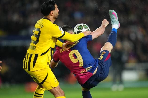 ESP: FC Barcelona, Barca v Borussia Dortmund. UEFA Champions League match. Quarter-Finals, firs leg Emre Can of Borussia Dortmund and Robert Lewandowski of FC Barcelona during the UEFA Champions League match, Quarter-Finals, firs leg, between FC Barcelona and Borussia Dortmund played at Lluis Companys Stadium on April 9 2025 in Barcelona Spain. kpng Copyright: xBaguxBlancox xPRESSINPHOTOx PS_240409_COP_BAR_BOR_4014