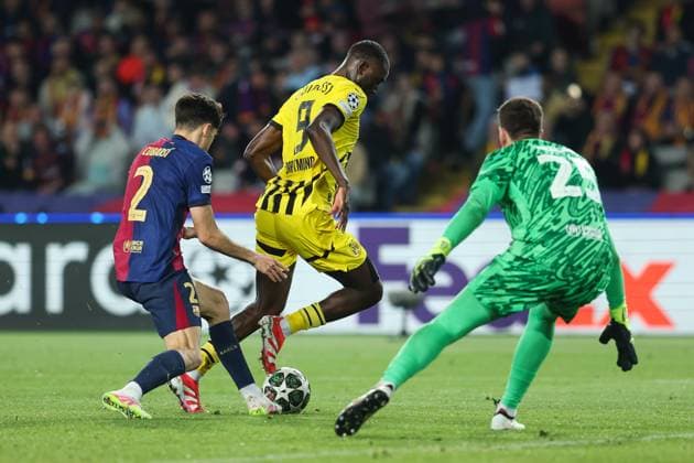 April 9, 2025, Barcelona, Barcelona, SPAIN: Pau Cubarsi of FC Barcelona, Barca Serhou Guirassy of Borussia Dortmund and Wokciech Szczesny of FC Barcelona in action during the UEFA Champions League 2024 25 quarter-final first leg, match between FC Barcelona and Borussia Dortmund at Estadi Olimpic Lluis Companys on April 09, 2025 in Barcelona, Spain. Barcelona SPAIN - ZUMAa181 20250409_zaa_a181_132 Copyright: xIrinaxR.xHipolitox