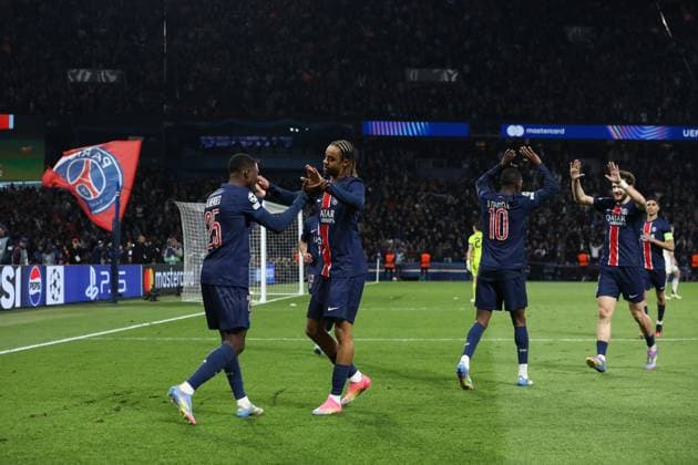 April 9, 2025, Paris, Ile-De-France, France: NUNO MENDES 25 of PSG celebrates with his teammate BRADLEY BARCOLA for scoring their side s third goal in the UEFA 2024 25 Quarter-Final first leg game between PARIS SAINT GERMAIN and ASTON VILLA at the Parc des Princes stadium in Paris, France Paris France - ZUMAc179 20250409_zep_c179_040 Copyright: xMickaelxChavetx