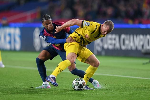 FC Barcelona, Barca v BORUSSIA DORMUND OLIMPIC STADIUM LLUIS COMPANYS. MONTJUIC,BARCELONA.April 9,2025 FC BARCELONA vs BORUSSIA DORMUND April 9,2025 Alejandro Balde (3) of FC Barcelona vies with (26) Julian Ryerson of Borussia Dortmund during the UEFA Champions League 2024 25 quarter finals match between FC Barcelona and Borussia Dormund at Olimpic Stadium Lluis Companys of MontjuÃ¯c in Barcelona, Spain. Barcelona ESP Copyright: xS.xRosx