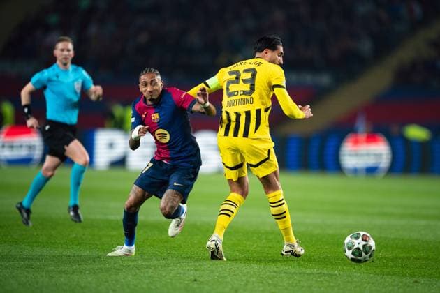 (250410) -- BARCELONA, April 10, 2025 -- Raphinha (L) of FC Barcelona, Barca vies with Emre Can of Borussia Dortmund during the UEFA Champions League quarterfinal 1st leg football match between FC Barcelona and Borussia Dortmund in Barcelona, Spain, on April 9, 2025. (Photo by Xinhua) (SP)SPAIN-BARCELONA-FOOTBALL-UEFA CHAMPIONS LEAGUE-FC BARCELONA VS BORUSSIA DORTMUND JoanxGosa 