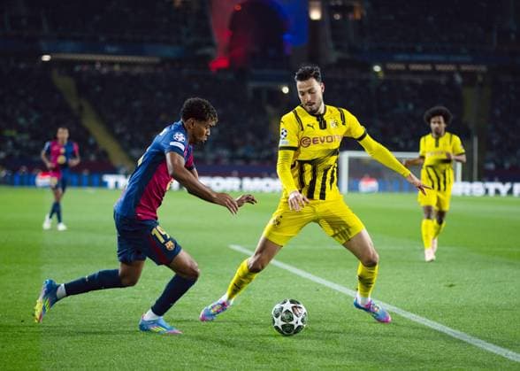 (250410) -- BARCELONA, April 10, 2025 -- Lamine Yamal (L) of FC Barcelona, Barca vies with Ramy Bensebaini of Borussia Dortmund during the UEFA Champions League quarterfinal 1st leg football match between FC Barcelona and Borussia Dortmund in Barcelona, Spain, on April 9, 2025. (Photo by Xinhua) (SP)SPAIN-BARCELONA-FOOTBALL-UEFA CHAMPIONS LEAGUE-FC BARCELONA VS BORUSSIA DORTMUND JoanxGosa 