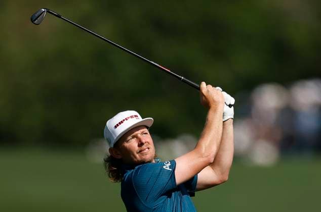 Cameron Smith of Australia watches his approach shot to the seventh green during the first round of the Masters golf tournament at Augusta National Golf Club in Augusta, Georgia on Thursday, April 10, 2025.  AUG20250410546 JOHNxANGELILLO