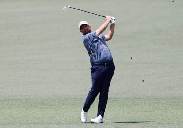 Shane Lowry of Ireland hits his approach shot on the second hole during the first round of the Masters golf tournament at Augusta National Golf Club in Augusta, Georgia on Thursday, April 10, 2025.  AUG20250410614 TANNENxMAURY