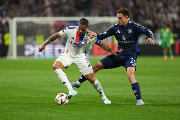 Corentin Tolisso of Lyon is tackled by Manuel Ugarte of Man Utd Olympique Lyonnais v Manchester United, ManU UEFA Europa League, Quarter Final, First Leg, Football, Groupama Stadium, Lyon, France - 10 Apr 2025 EDITORIAL USE ONLY No use with unauthorised audio, video, data, fixture lists, club league logos or live services. Online in-match use limited to 120 images, no video emulation. No use in betting, games or single club league player publications. Copyright: xDavexWinter Shutterstockx 15243617w