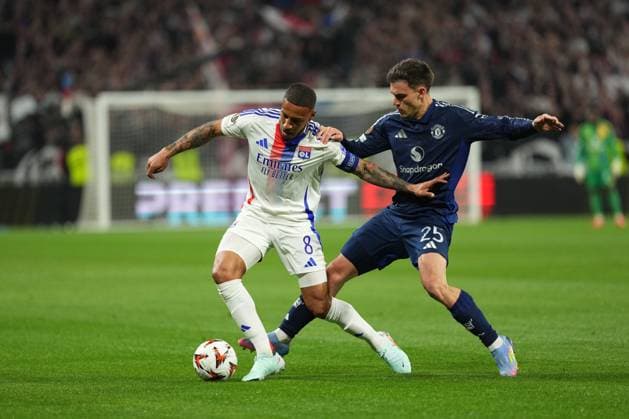 Corentin Tolisso of Lyon is tackled by Manuel Ugarte of Man Utd Olympique Lyonnais v Manchester United, ManU UEFA Europa League, Quarter Final, First Leg, Football, Groupama Stadium, Lyon, France - 10 Apr 2025 EDITORIAL USE ONLY No use with unauthorised audio, video, data, fixture lists, club league logos or live services. Online in-match use limited to 120 images, no video emulation. No use in betting, games or single club league player publications. Copyright: xDavexWinter Shutterstockx 15243617x