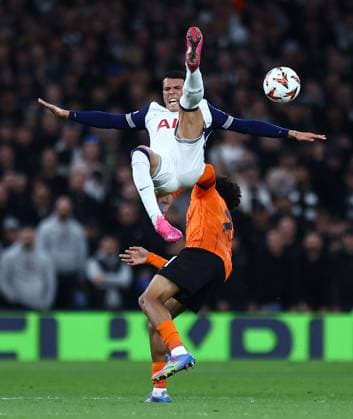 Pedro Porro of Tottenham Hotspur is fouled by Nathaniel Brown of Eintracht Frankfurt Tottenham Hotspur v Eintracht Frankfurt, UEFA Europa League, Quarter Final, First Leg, Football, Tottenham Hotspur Stadium, London, UK - 10 Apr 2025 EDITORIAL USE ONLY No use with unauthorised audio, video, data, fixture lists, club league logos or live services. Online in-match use limited to 120 images, no video emulation. No use in betting, games or single club league player publications.  Copyright: xMichaelxZemanek Shutterstockx 15243632v