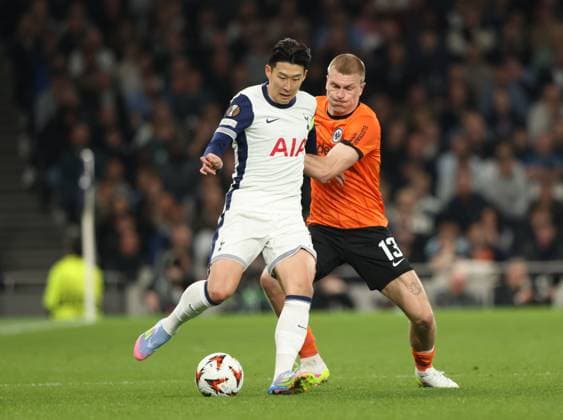 Heung-Min Son (TH) Rasmus Kristensen (EF) at the Tottenham Hotspur v Eintracht Frankfurt UEFA Europa League match, at the Tottenham Hotspur Stadium, London, UK on 10th April, 2025. 