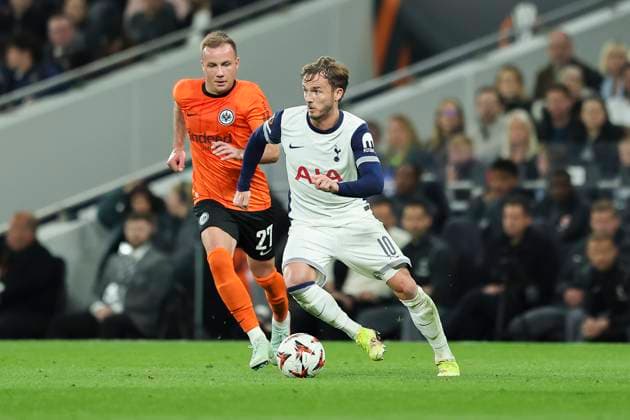 10th April 2025; Tottenham Hotspur Stadium, London, England; UEFA Europa League Quarter Final First Leg Football, Tottenham Hotspur versus Eintracht Frankfurt; James Maddison of Tottenham feels pressure from Mario Gotze of Eintracht Frankfurt  ActionPlus12772921 HenningxVonxJagow