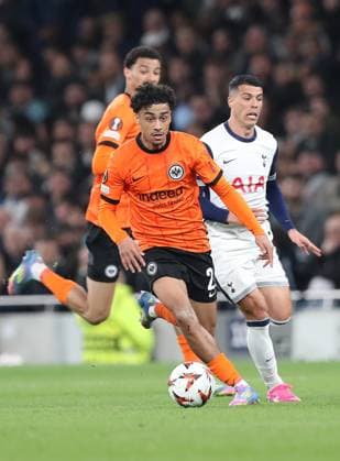 10 04 2025, xtgx, Football Europa League 1 4 Final, Tottenham Hotspur Eintracht Frankfurt v l Nathaniel Brown Eintracht Frankfurt , Pedro Porro of Tottenham Hotspur DFL DFB REGULATIONS PROHIBIT ANY USE OF PHOTOGRAPHS as IMAGE SEQUENCES and or QUASI VIDEO London