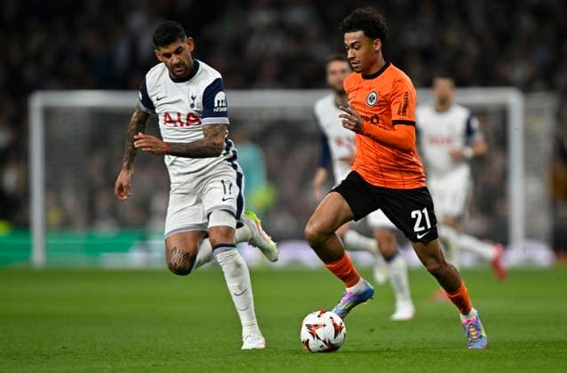 Tottenham Hotspur V Eintracht Frankfurt, Europa League. Nathaniel Brown (Frankfurt) goes past Cristian Romero (Spurs) during the Tottenham Hotspur V Eintracht Frankfurt UEFA Europa Conference League quarter-final match at the Tottenham Hotspur Stadium, London. Tottenham Tottenham Hotspur Stadium UK Copyright: xMartinxDaltonx Spurs_v_Frankfurt_100425_MD_006