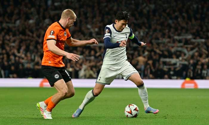 Tottenham Hotspur V Eintracht Frankfurt, Europa League. Son Heung-min (Spurs) and Rasmus Kristensen (Frankfurt) during the Tottenham Hotspur V Eintracht Frankfurt UEFA Europa Conference League quarter-final match at the Tottenham Hotspur Stadium, London. Tottenham Tottenham Hotspur Stadium UK Copyright: xMartinxDaltonx Spurs_v_Frankfurt_100425_MD_039