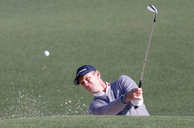Justin Rose of England hits out of a bunker on the second hole during round two of the 2025 Masters golf tournament at Augusta National Golf Club in Augusta, Georgia, on Friday, April 11, 2025.  AUG20250411501 TANNENxMAURY
