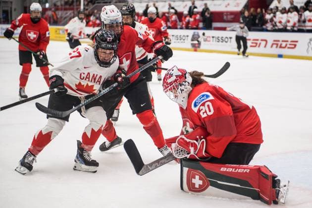 (L-R) Emma Maltais of Canada, Alena Rossel of Switzerland and goalkeeper Andrea Braendli of Switzerland in action during the Ice hockey, Eishockey IIHF WomenÂ s World Championship, WM, Weltmeisterschaft Group A, match Switzerland vs Canada, Ceske Budejovice, Czech Republic, April 11, 2025. (CTKxPhoto PetrxSkrivanek) CTKPhotoP2025041106489  CTKPhotoP2025041106489