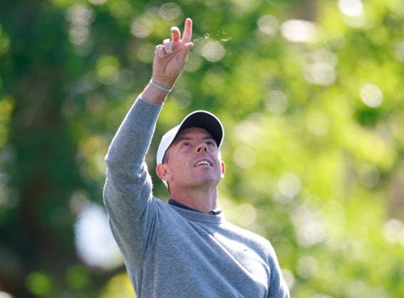 Rory McIlroy of Northern Ireland tests the wind as he prepares to tee off on the fourth hole during round two of the 2025 Masters golf tournament at Augusta National Golf Club in Augusta, Georgia, on Friday, April 11, 2025.  AUG20250411521 JOHNxANGELILLO