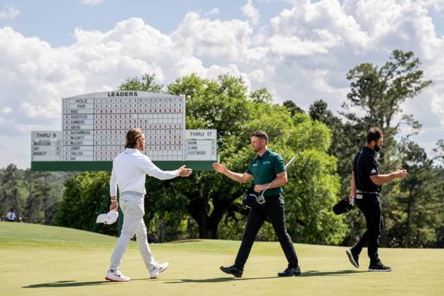 250411 Tommy Fleetwood of England, Wyndham Clark of the United States and Jon Rahm of Spain on the 18th green during the second round of the 2025 Masters Golf Tournament on April 11, 2025 in Augusta Photo Petter Arvidson BILDBYRAN kod PA PA1008 bbeng golf masters the masters augusta us masters  Copyright: PETTERxARVIDSON BB250411PA114