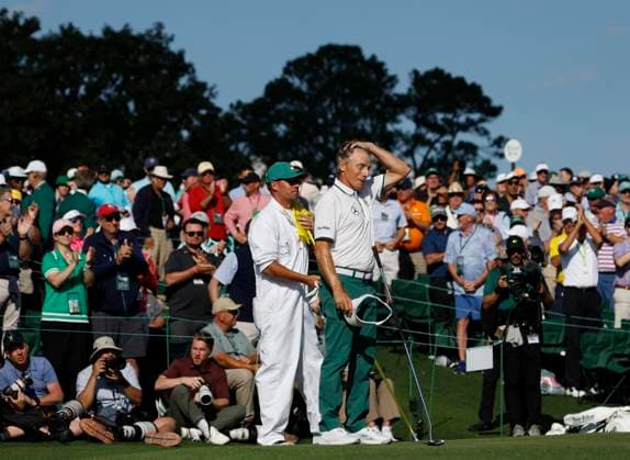 Bernhard Langer of Germany reacts as he stands on the 18th green with his son and caddie Jason during the second round of the 2025 Masters golf tournament at Augusta National Golf Club in Augusta, Georgia, on Friday, April 11, 2025. Langer a two-time winner of the green jacket in 1985 and 1993 had announced that his 41st Masters appearance will be his last. Langer missed the cut making a bogey on the 18th hole.  AUG202504112002 JOHNxANGELILLO