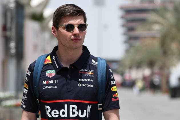 (250412) -- SAKHIR, April 12, 2025 -- Red Bull s driver Max Verstappen of the Netherlands arrives in the paddock on the first day of the Formula One Bahrain Grand Prix at the Bahrain International Circuit in Sakhir, Bahrain, on April 11, 2025. (Photo by Xinhua) (SP)BAHRAIN-SAKHIR-F1-GRAND PRIX-PRACTICE QianxJun 