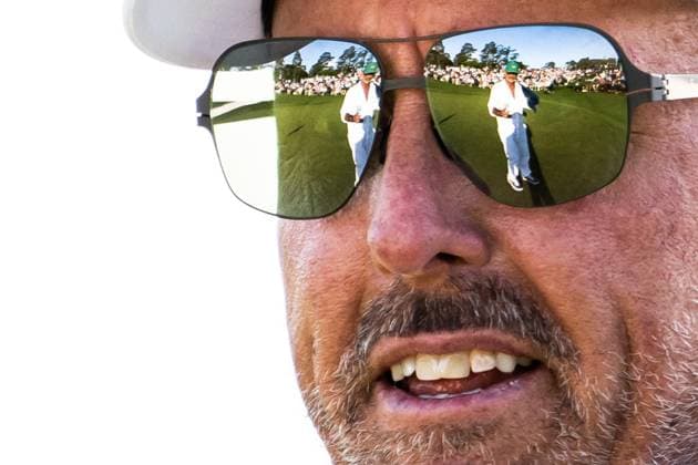250411 Caddie Jon Yarbrough is seen through a reflection from Phil Mickelson of the United States sunglasses during the second round of the 2025 Masters Golf Tournament on April 11, 2025 in Augusta Photo Petter Arvidson BILDBYRAN kod PA PA1008 bbeng golf masters the masters augusta us masters  Copyright: PETTERxARVIDSON BB250411PA227