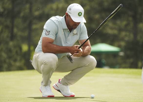 (250412) -- AUGUSTA, April 12, 2025 -- Bryson DeChambeau of the United States lines up a putt during round 2 of the 2025 Masters golf tournament at Augusta National Golf Club in Augusta, the United States, on April 11, 2025. ) (SP)U.S.-AUGUSTA-GOLF-2025 MASTERS-ROUND 2 WuxXiaoling 