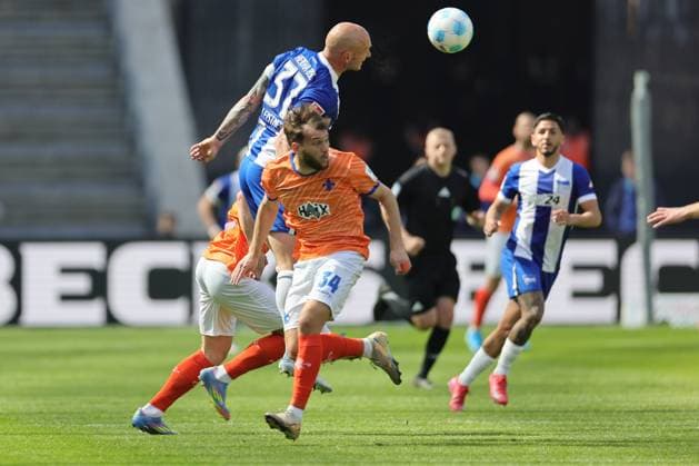 2 Soccer Bundesliga, Hertha BSC SV Darmstadt Toni Leistner Hertha BSC Berlin 37 in a duel with Killian Corredor SV Darmstadt 34 , during the match in the 2 Soccer Bundesliga, Hertha BSC SV Darmstadt in Berlin, Olympiastadion, on 12 04 2025 DFB regulations prohibit any use of photographs as image sequences and or quasi video Copyright: xBEAUTIFULxSPORTS Frankex