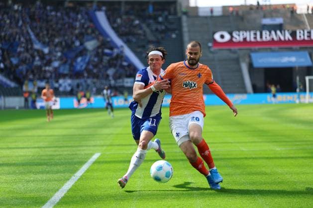 2 Soccer Bundesliga, Hertha BSC SV Darmstadt Fabian Reese Hertha BSC Berlin 11 in a duel with Aleksandar Vukoti SV Darmstadt 29 , during the match in the 2 Soccer Bundesliga, Hertha BSC SV Darmstadt in Berlin, Olympiastadion, on 12 04 2025 DFB regulations prohibit any use of photographs as image sequences and or quasi video Copyright: xBEAUTIFULxSPORTS Frankex