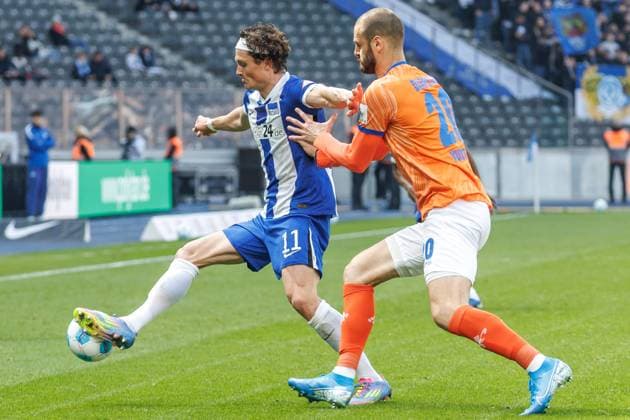 Berlin,12 4 25, Soccer, 2 Bundesliga, Matchday 29, Hertha BSC SV Darmstadt 98, Olympiastadion Berlins Fabian Reese fights for the ball against Vukotic Aleksandar of SV Darmstadt 98 DFL regulations and DFB regulations prohibit any use of photographs as image sequences and or quasi video, Foto Andreas Gora Hertha BSC SV Darmstadt 98