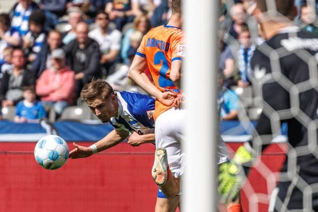 Berlin,12 4 25, Soccer, 2 Bundesliga, Matchday 29, Hertha BSC SV Darmstadt 98, Olympiastadion Lopez Sergio of SV Darmstadt 98 fights Berlins Marten Winkler for the ball DFL regulations and DFB regulations prohibit any use of photographs as image sequences and or quasi video, Foto Andreas Gora Hertha BSC SV Darmstadt 98
