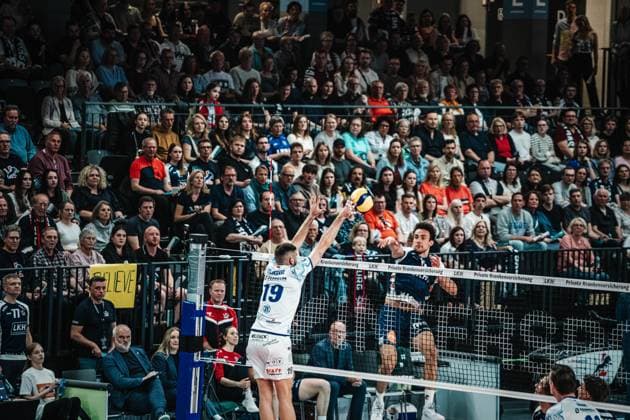 Volleyball Men Season 2024 2025 Volleyball Bundesliga Playoff Semifinal Match 3 SVG Lüneburg vs VfB Friedrichshafen 12 04 2025 Xander Wolf Wassenaar Ketrzynski 11 SVG Lüneburg against the block of Ivan Zeljkovic 19 VfB Friedrichshafen in front of full stands Lüneburg LKH Arena Niedersachsen Germany