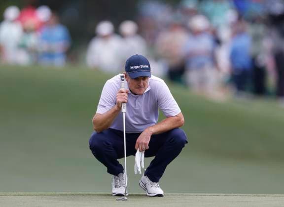 Justin Rose of England lines up a putt on the 3rd hole during the third round of the 2025 Masters golf tournament at Augusta National Golf Club in Augusta, Georgia, on Saturday, April 12, 2025.  AUG20250412531 JOHNxANGELILLO
