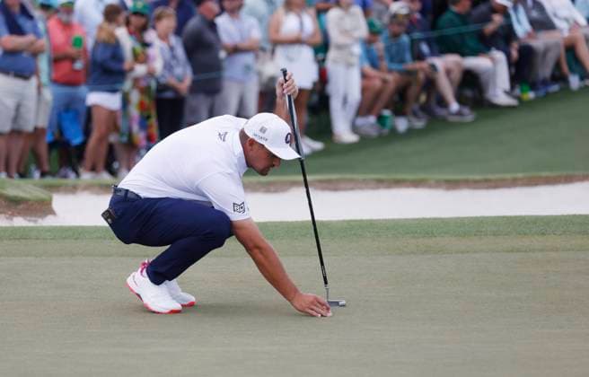 Bryson DeCambeau prepares to putt on the 2nd green during the third round of the 2025 Masters golf tournament at Augusta National Golf Club in Augusta, Georgia, on Saturday, April 12, 2025.  AUG20250412538 TANNENxMAURY