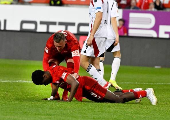 Football 2 Bundesliga Season 2024 25 1 FC Kaiserslautern 12 04 2025 Fritz Walter Stadion 1 FC Kaiserslautern fck 1 FC Nürnberg fcn 1 2 Marlon RITTER 1 FC Kaiserslautern , helps Ragnar ACHE 1 FC Kaiserslautern get back on his feet 1 FC Kaiserslautern