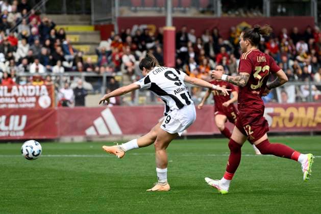 Sofia Cantore of Juventus FC, challenged by Elena Linari of AS Roma, scores the goal of 0-2 during the Women s Serie A 2024 2025 play off football match between AS Roma and Juventus FC at Tre Fontane stadium in Roma (Italy), April 13, 2025. AndreaxStaccioli