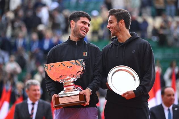 Carlos Alcaraz Wins Rolex Monte Carlo Tournament - Monaco Carlos Alcaraz (ESP) and Lorenzo Musetti (ITA) celebrate with their trophies during the Monte Carlo ATP, Tennis Herren Masters Series Tournament final tennis match at the Monte Carlo Country Club in Monte Carlo, Monaco on April 13, 2025. Photo by Corinne Dubreuil ATP Tour ABACAPRESS.COM Monaco Monte-Carlo Monaco  Copyright: xDubreuilxCorinne ABACAx