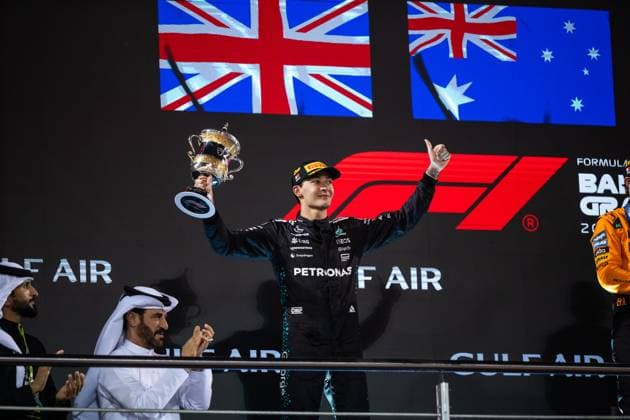 George Russell Mercedes AMG Petronas F1 Team, Great Britain, 63 cheers on the podium at the podium ceremony with trophy for 2nd place, BAH, Formula 1 World Championship, Gulf Air Grand Prix of Bahrain, Bahrain International Circuit, Race, 2025 season, 13 04 2025 BAH, Formula 1 World Championship, Gulf Air Grand Prix of Bahrain, Bahrain International Circuit, Race, 2025 season, 13 04 2025 Sakhir Copyright: xEibner-Pressefoto Memmlerx EP_MMR