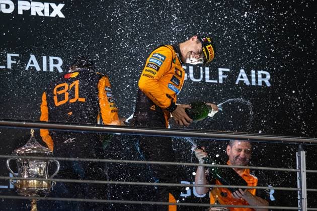 Lando Norris McLaren Formula 1 Team, Great Britain, 04 , Oscar Piastri McLaren Formula 1 Team, Australia, 81 , Andrea Stella McLaren Formula 1 Team, Team Principal celebrating victory and 3rd place on the podium with champagne, BAH, Formula 1 World Championship, Gulf Air Grand Prix of Bahrain, Bahrain International Circuit, Race, 2025 season, 13 04 2025 BAH, Formula 1 World Championship, Gulf Air Grand Prix of Bahrain, Bahrain International Circuit, Race, 2025 season, 13 04 2025 Sakhir Copyright: xEibner-Pressefoto Memmlerx EP_MMR