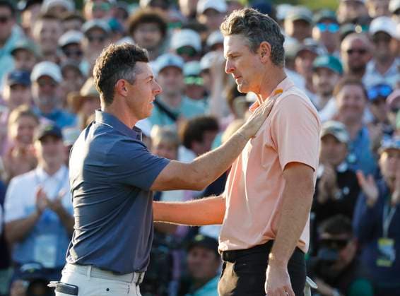 Sport Bilder des Tages Rory McIlroy of Northern Ireland and Justin Rose of England talk after McIlroy won a sudden death playoff to win the 2025 Masters golf tournament at Augusta National Golf Club in Augusta, Georgia, on Sunday, April 13, 2025. McIlroy becomes the 6th person to complete the career grand slam.  AUG20250413618 JOHNxANGELILLO