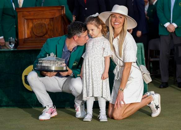 Rory McIlroy poses with his wife Erica Stoll and daughter Poppy after winning the 2025 Masters golf tournament at Augusta National Golf Club in Augusta, Georgia, on Sunday, April 13, 2025. McIlroy defeated Justin Rose of England in a playoff and becomes the 6th person to complete the career grand slam.  AUG20250413690 JOHNxANGELILLO