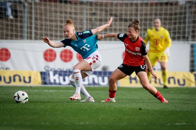 Womens Soccer Bundesliga Bayer 04 Leverkusen 1 FC Köln, 14 04 2025 Kristin Kögel Bayer 04 Leverkusen, 11 holds Laura Vogt 1 FC Köln, 8 in a duel on the Bayer 04 Leverkusen 1 FC Köln jersey on matchday 19 of the Google Pixel Womens Bundesliga on 14 04 2025 at Ulrich Haberland Stadium in Leverkusen North Rhine-Westphalia DFL REGULATIONS PROHIBIT ANY USE OF PHOTOGRAPHS AS IMAGE SEQUENCES AND OR QUASI VIDEO Copyright: xBEAUTIFULxSPORTS AxelxKohringx